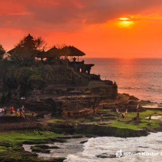 Scenic view of Tanah Lot Temple by the sea in Bali, famous cultural landmark