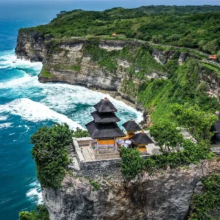 Uluwatu Temple perched on a high cliff with panoramic ocean views in Bali